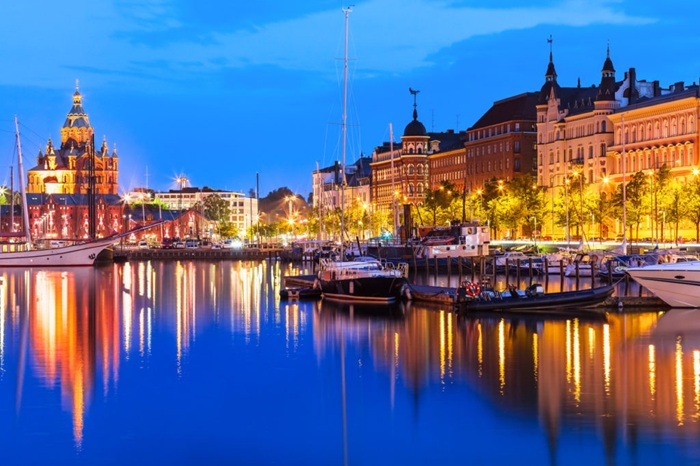 Scenic summer evening panorama of the Old Port pier architecture with tall historical sailing ships, yachts and boats and Uspenski Orthodox Cathedral in the Old Town in Helsinki, Finland (Scenic summer evening panorama of the Old Port pier architectur